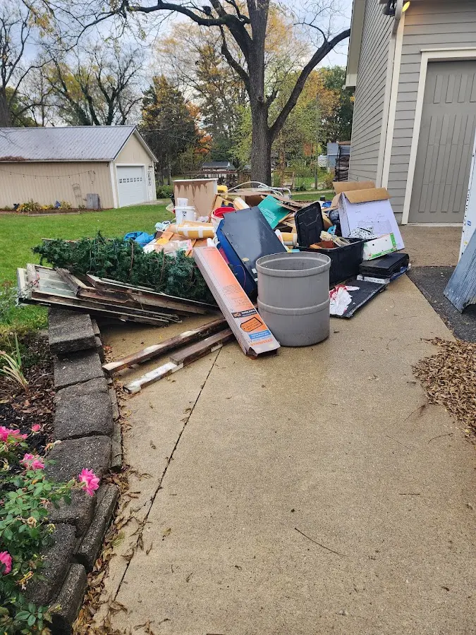 Dumpster being loaded with debris for Residential Dumpster Rental in Pulaski